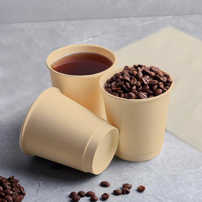 Two cups of coffee and beans on a table, with 8oz Disposable Coffee Cups made from Bagasse.